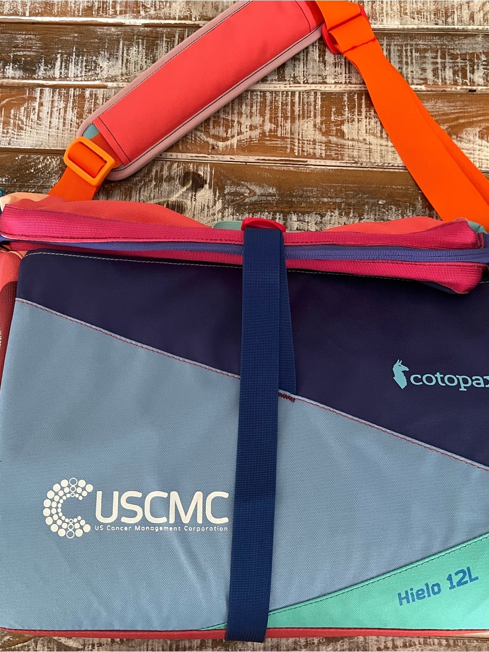 cotopaxi Hielo 12L Colorblock Cooler Bag — Navy, Light Blue, Teal, Coral, Orange
